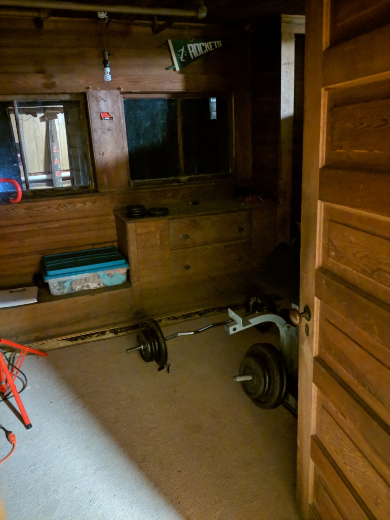 What? It's just a weight room.
With bare insulation and no actual lights save a worklight on a pole...
